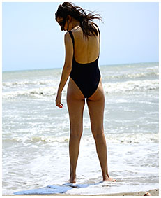 debbie pisses her swimsuit on the beach swim suit pee wetting swimsuits 04