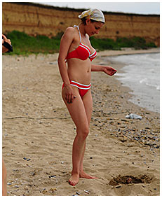 bathing suit accident wetting on the beach sand 03
