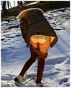 Peeing her pants making snow angels