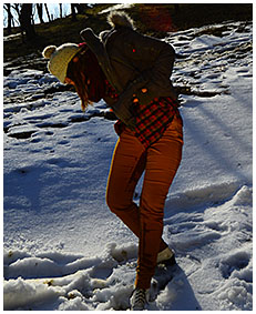 Peeing her pants making snow angels