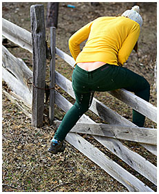 gemma climbs fence pees green jeans 04