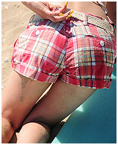 alice is pissing her shorts on the beach 00
