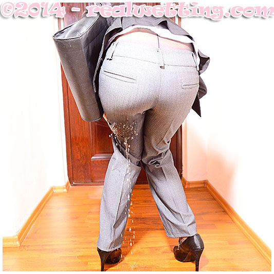 Antonia pisses herself wetting her business suit pantyhose and gray tight ass pants urinating in her clothing