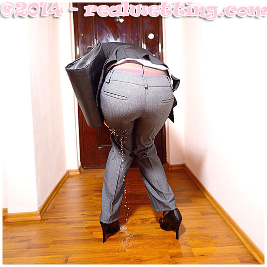 Antonia pisses herself wetting her business suit pantyhose and gray tight ass pants urinating in her clothing