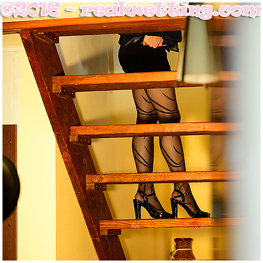 Antonia goes peeing into her pantyhose on the stairs