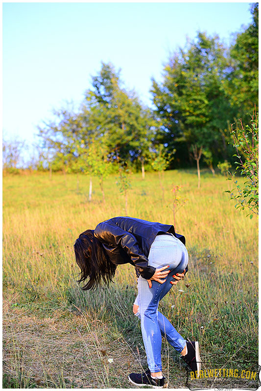 Young girl wets her jeans walking up the trail jeans 