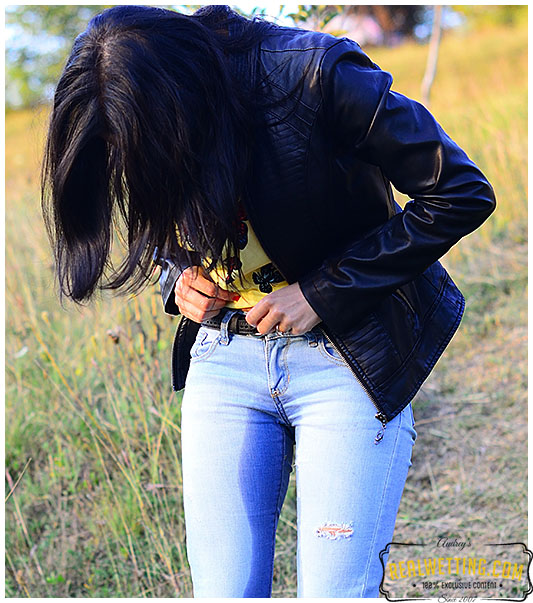 Young girl wets her jeans walking up the trail jeans 