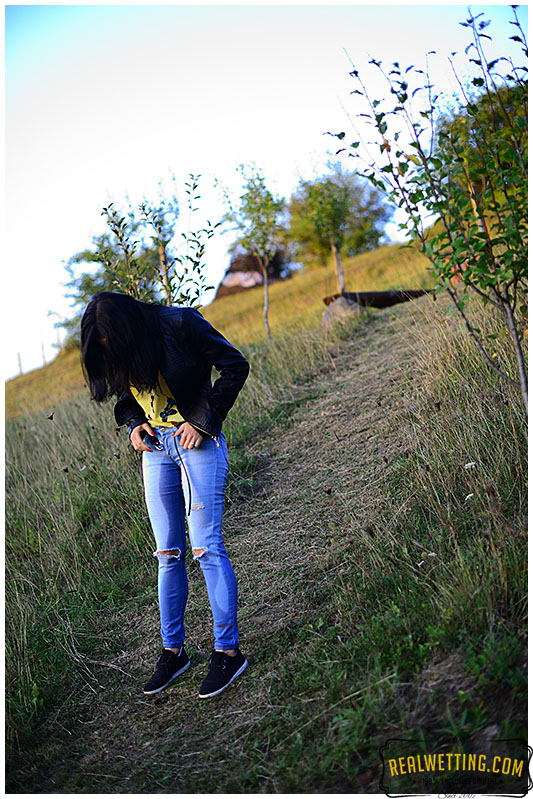 Young girl wets her jeans walking up the trail jeans 