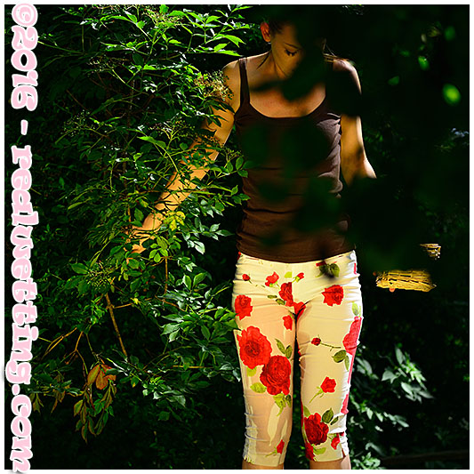 Claudia wets her flowery pants in the orchard