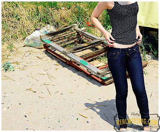 Tight blue jeans while walking casually on the beach!