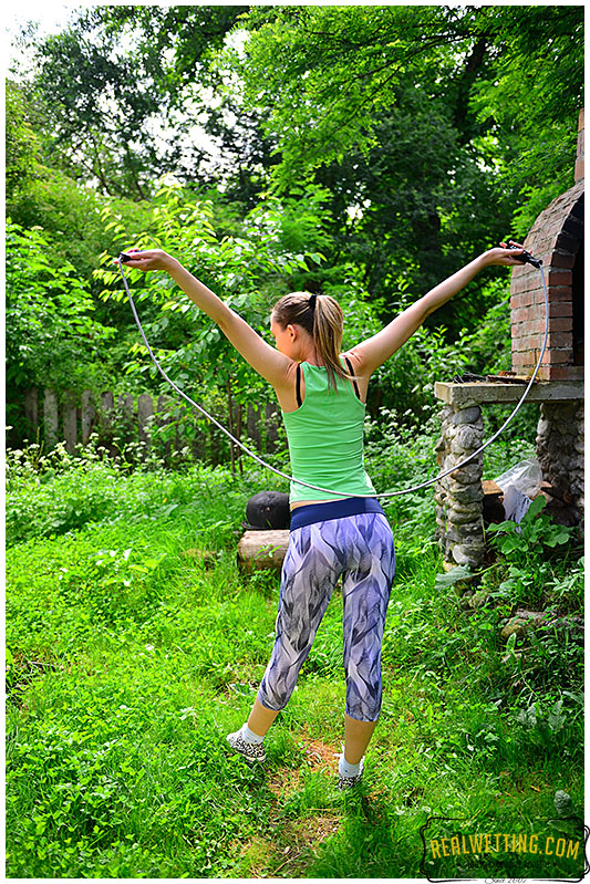 Claudia jumps rope wearing tights