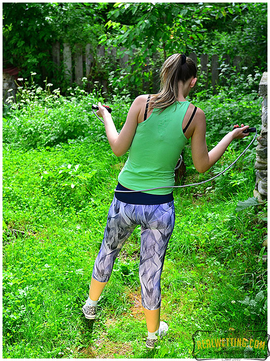 Claudia jumps rope wearing tights