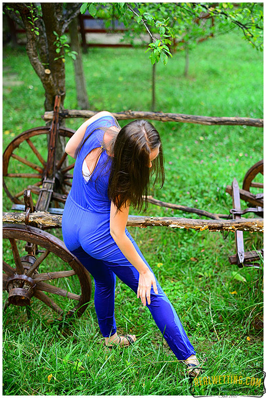 She made the dark spot between her legs grow larger and larger as she was pissing into her pants