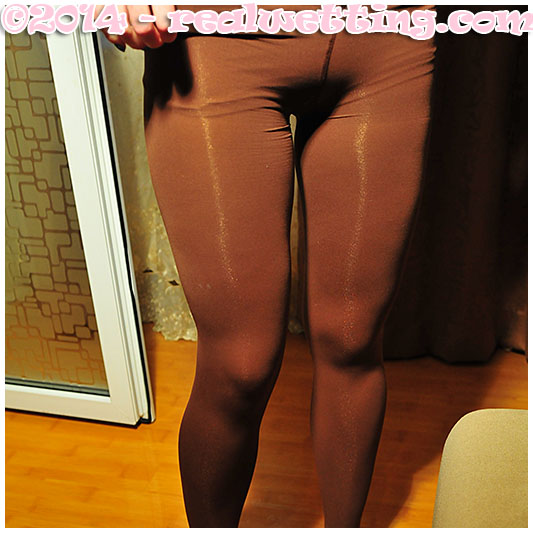 Dominika wets herself on the table peeing her pantyhose and pink knickers