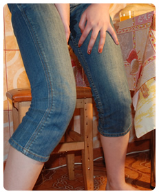 Teenager Alice is pissing herself in jeans overalls