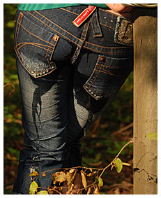 girl wets herself bound to a tree going in her jeans
