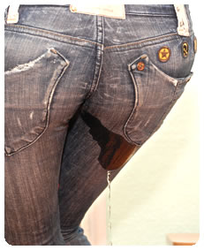 sexy girl pisses her jeans wetting pissing accident desperation and wetting full bladder