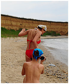 bathing suit accident wetting on the beach sand 01