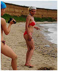 bathing suit accident wetting on the beach sand 02