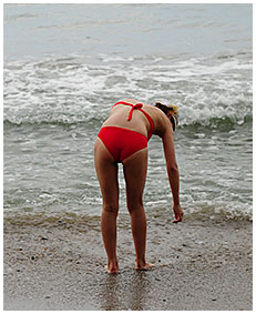 bathing suit accident wetting on the beach sand 00