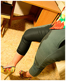 New model Gemma wets her green skin-tight capris waiting