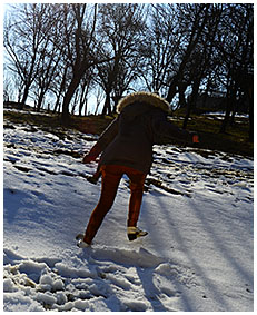 Peeing her pants making snow angels