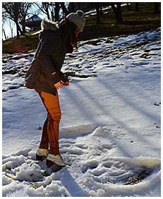 Peeing her pants making snow angels