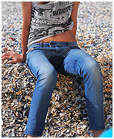 beach desperation natalie wets her blue jeans on the beach pissing herself 04