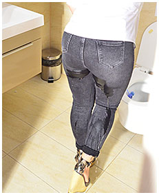 lady wearing tight black jeans wets herself while wiping toilet 2