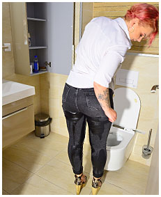 lady wearing tight black jeans wets herself while wiping toilet 3