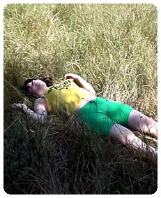alice while lying in the grass she wets her green shorts on purpose
