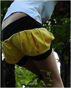 dee climbing down a tree pees her yellow shorts2