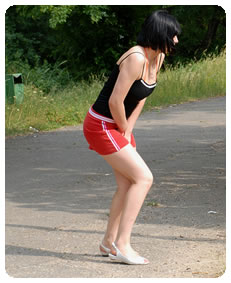 desperate teenager pisses her knickers in public wetting her skirt