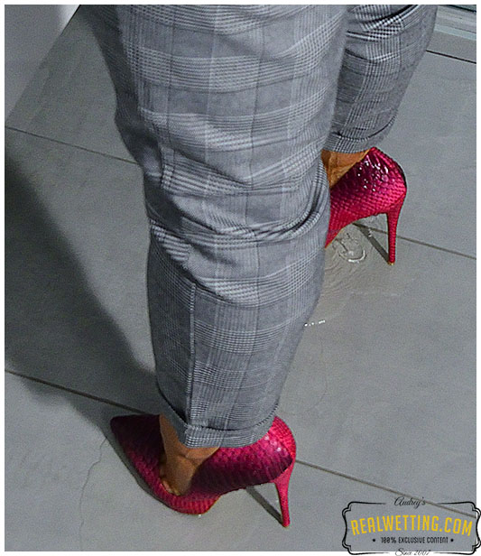 She wet her business pants and business panties next to the toilet