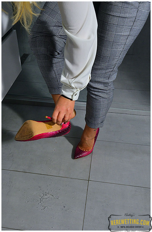 She wet her business pants and business panties next to the toilet