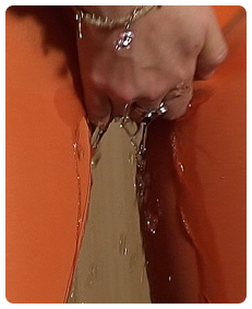 she is pissing her orange pantyhose being really desperate to pee