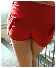 red shorts piss wetting herself