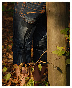 Bound girl Alice wetting her jeans being tied up