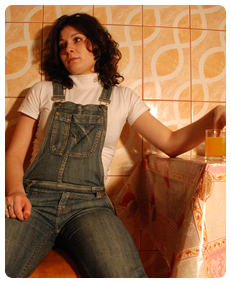 Teenager Alice is pissing herself in jeans overalls