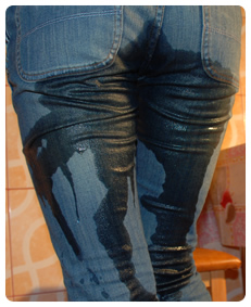 wet patch on her jeans pissing herself showing her piss